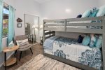 The second bedroom sleeps 3 guests with a bunk bed and twin
